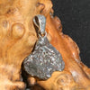 This pendant is displayed on driftwood and has a Sterling Silver bail