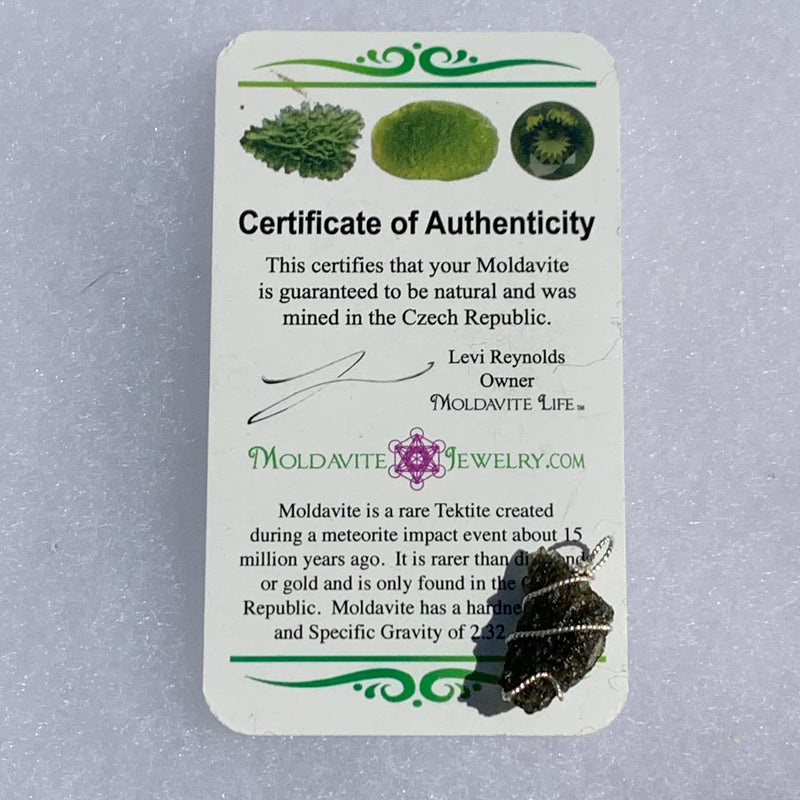 Moldavite sterling silver pendant displayed on our certificate of authenticity