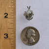 sterling silver Russian phenacite basket pendant next to a ruler and US quarter for scale