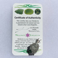 sterling silver moldavite tektite and Russian phenacite basket pendant with a moldavite life certificate of authenticity