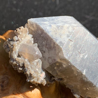 close up view of a smokey quartz point cluster with tiny brookite crystals throughout