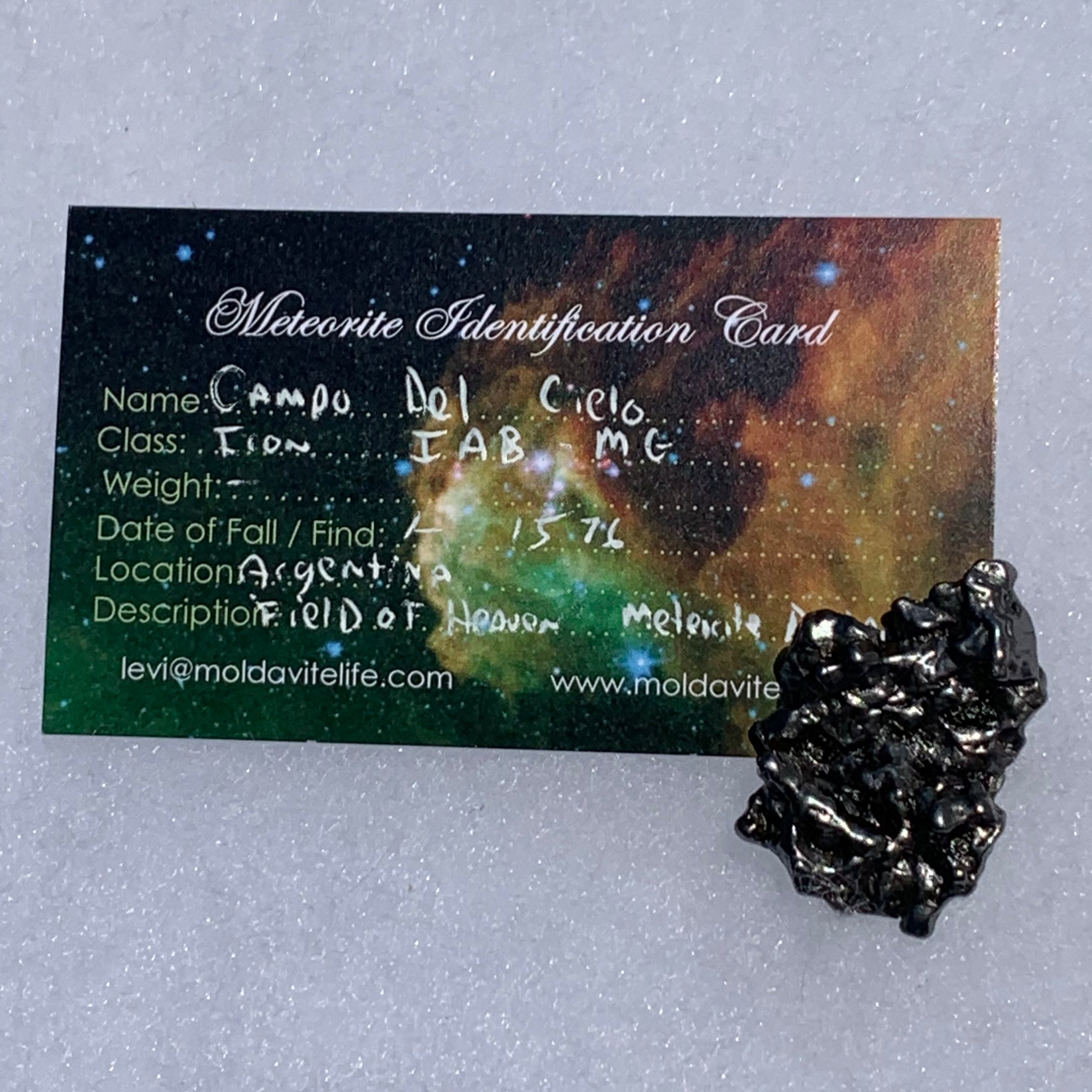 silver campo del cielo meteorite with a moldavite life meteorite identification card