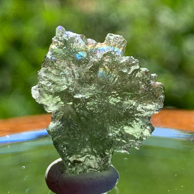 thin green besednice moldavite tektite on display