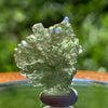 thin green besednice moldavite tektite on display