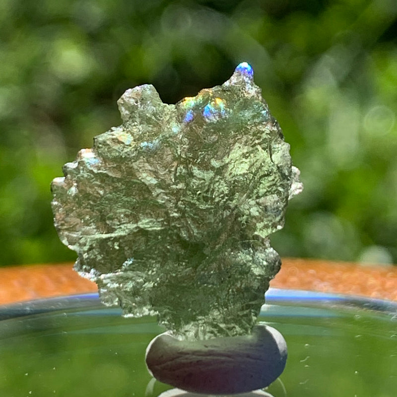 thin green besednice moldavite tektite on display