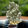 thin green besednice moldavite tektite on display