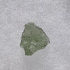 thin green besednice moldavite tektite on display