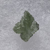 thin green besednice moldavite tektite on display