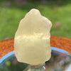 light reflects a rainbow through the libyan desert glass on display