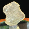 light reflects a rainbow through the libyan desert glass on display