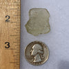 libyan desert glass next to a ruler and US quarter for scale