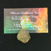 libyan desert glass sits with a moldavite life meteorite identification card