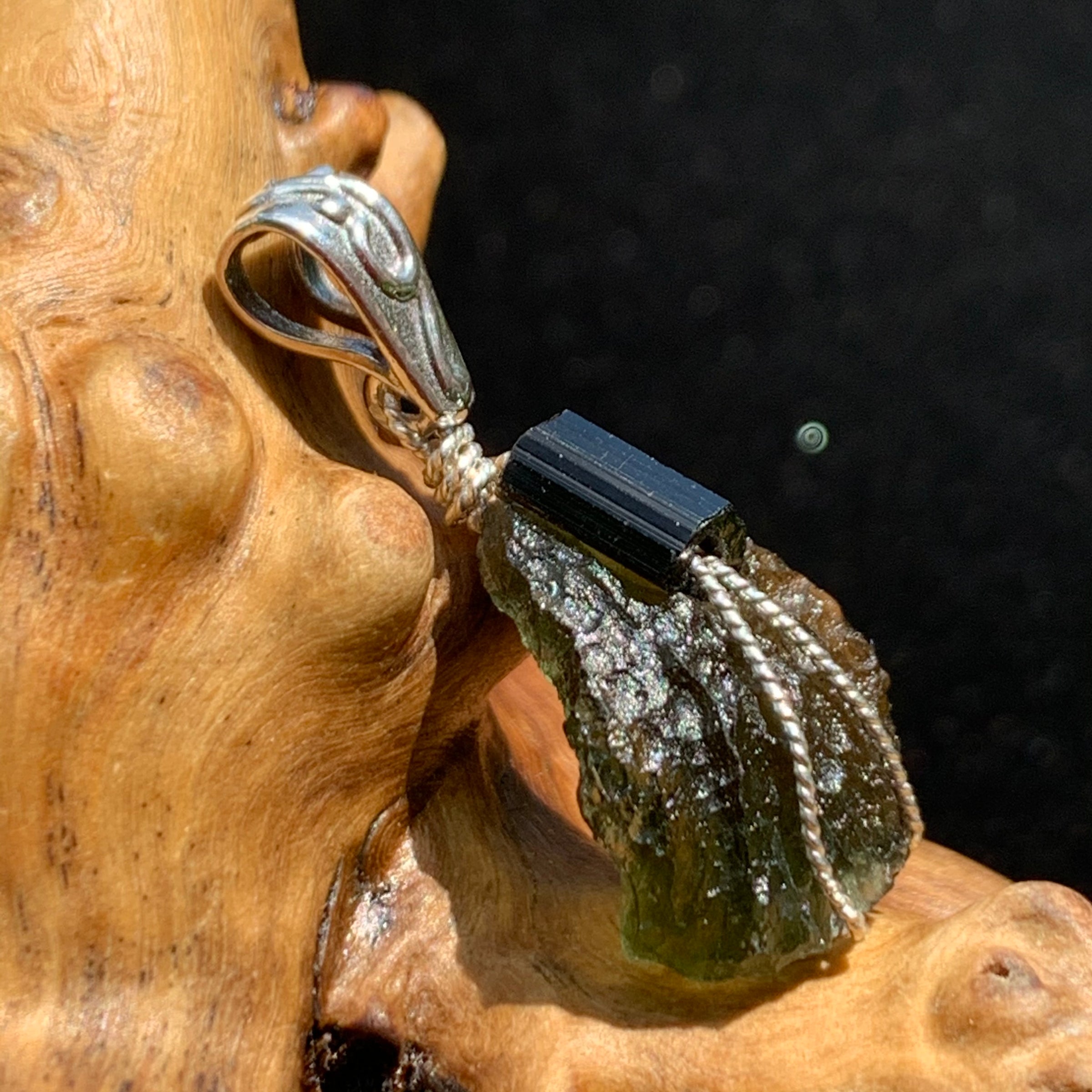 the moldavite has a lovely curve from the side 