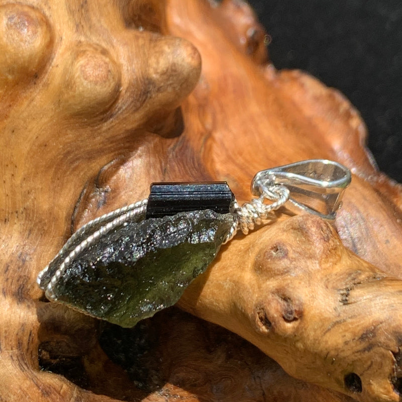 the moldavite tourmaline pendant is shown from the other side