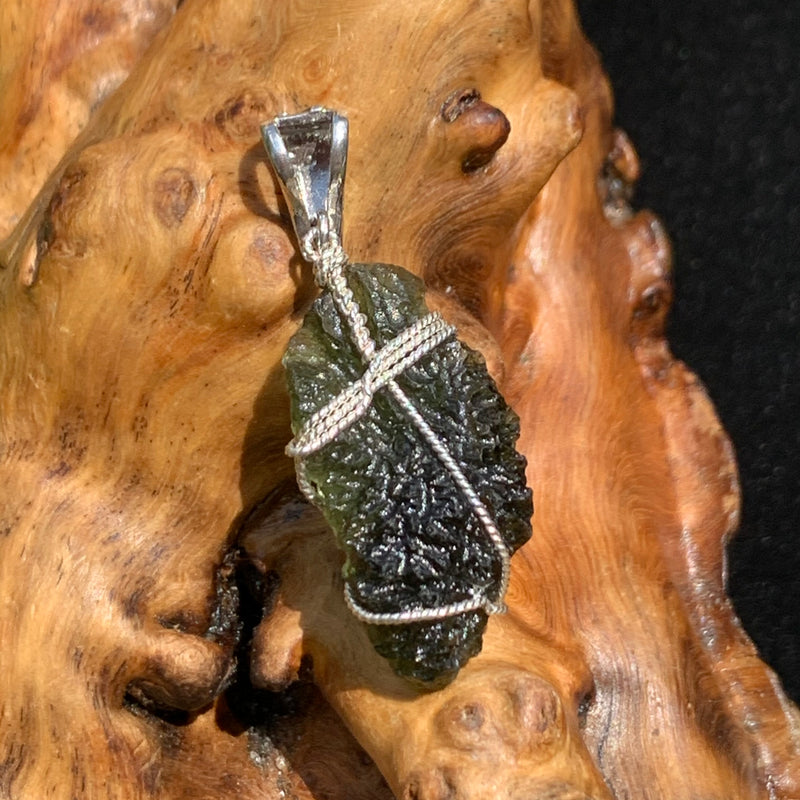 back view of moldavite wire wrapped with a herkimer diamond in sterling silver with a sterling bail