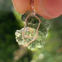 beautiful light shines through the moldavite and herkimer diamond