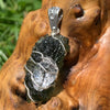 the herkimer diamond is featured against the texture of the moldavite