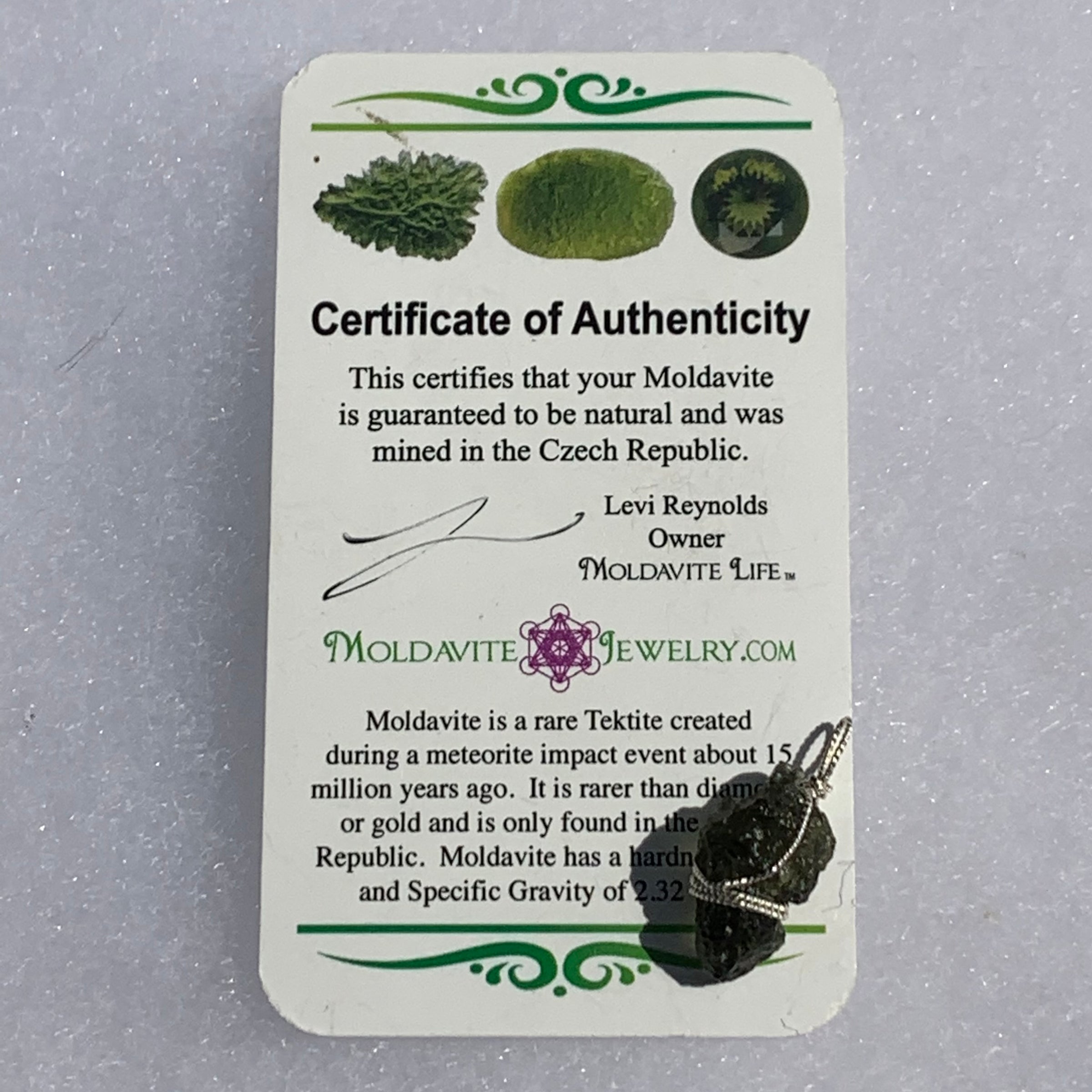 the certificate of authenticity with the moldavite pendant