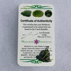 Moldavite sterling silver pendant displayed on the certificate of authenticity