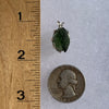 raw moldavite tektite sterling silver basket pendant next to a ruler and US quarter for scale