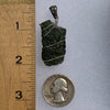 sterling silver wire wrapped raw moldavite tektite pendant next to a ruler and US quarter for scale