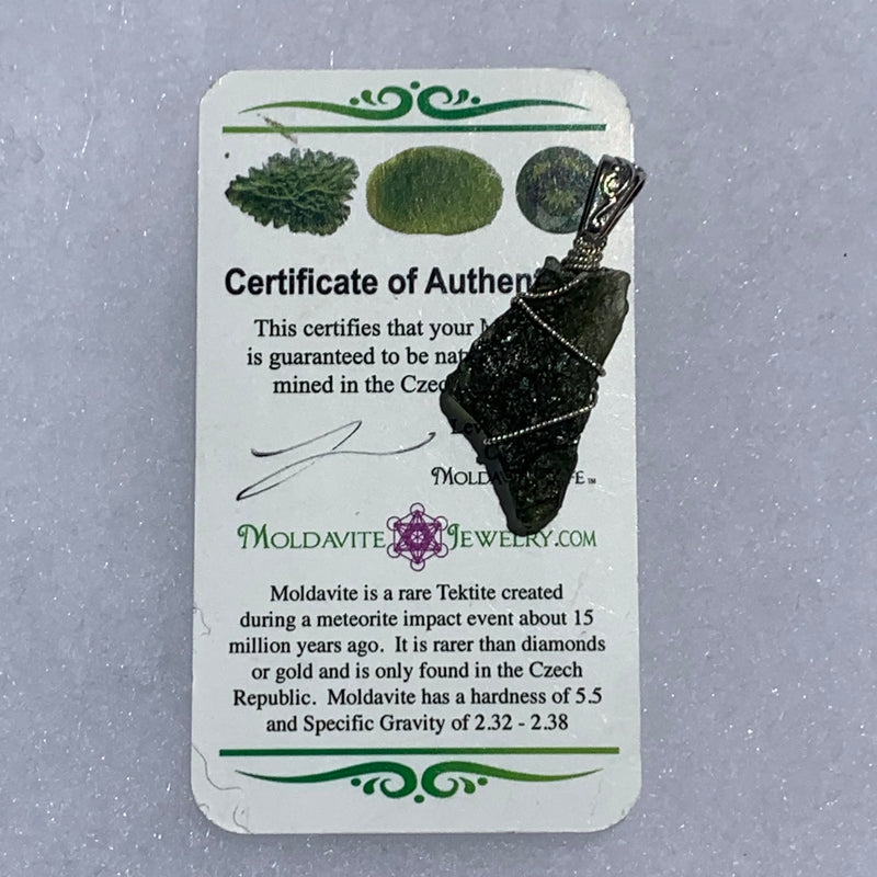sterling silver wire wrapped raw moldavite tektite pendant with a moldavite life certificate of authenticity