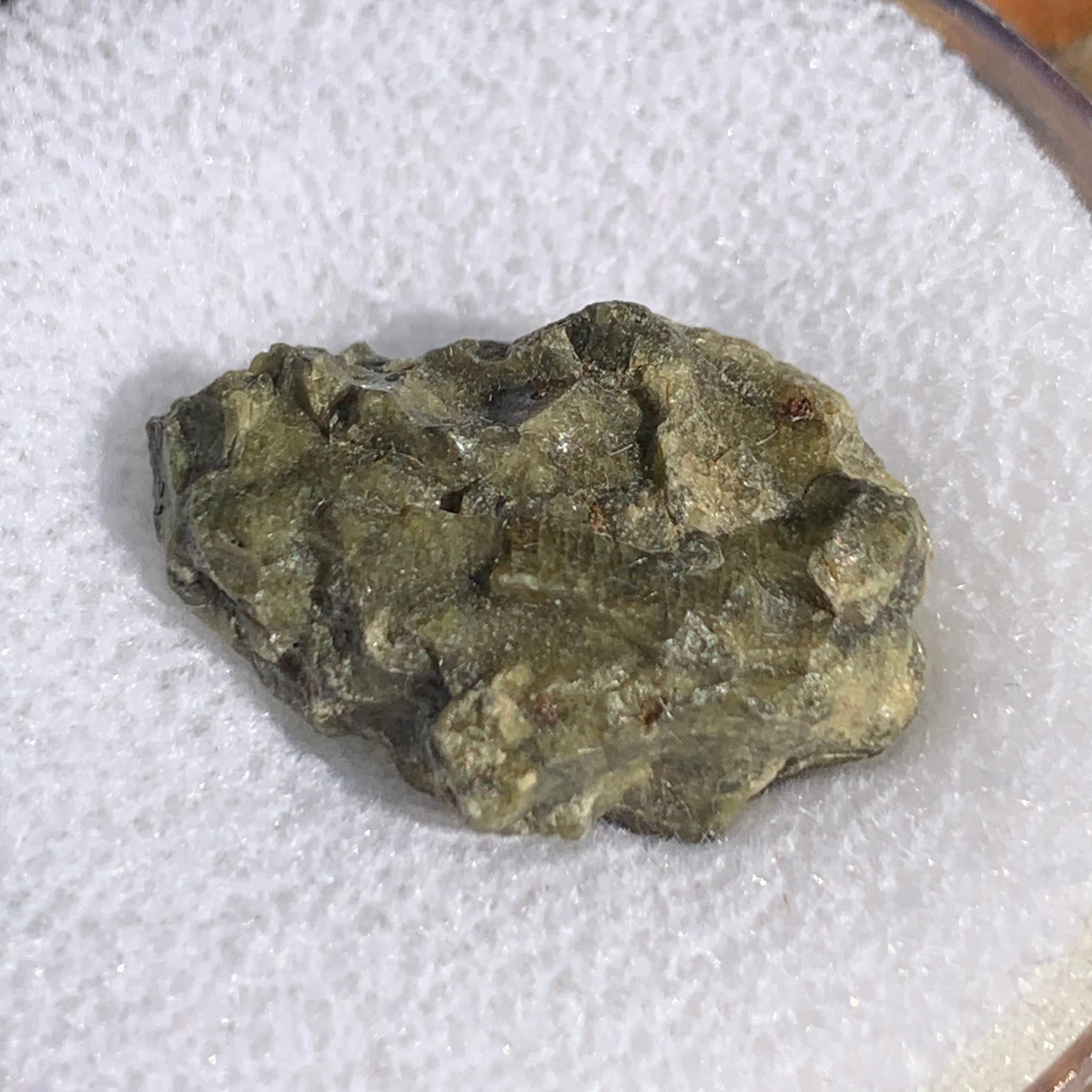 close up view of tatahouine meteorite in gem jar