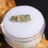 tatahouine meteorite in gem jar sitting on driftwood for display