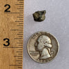 tatahouine meteorite next to a ruler and US quarter for scale