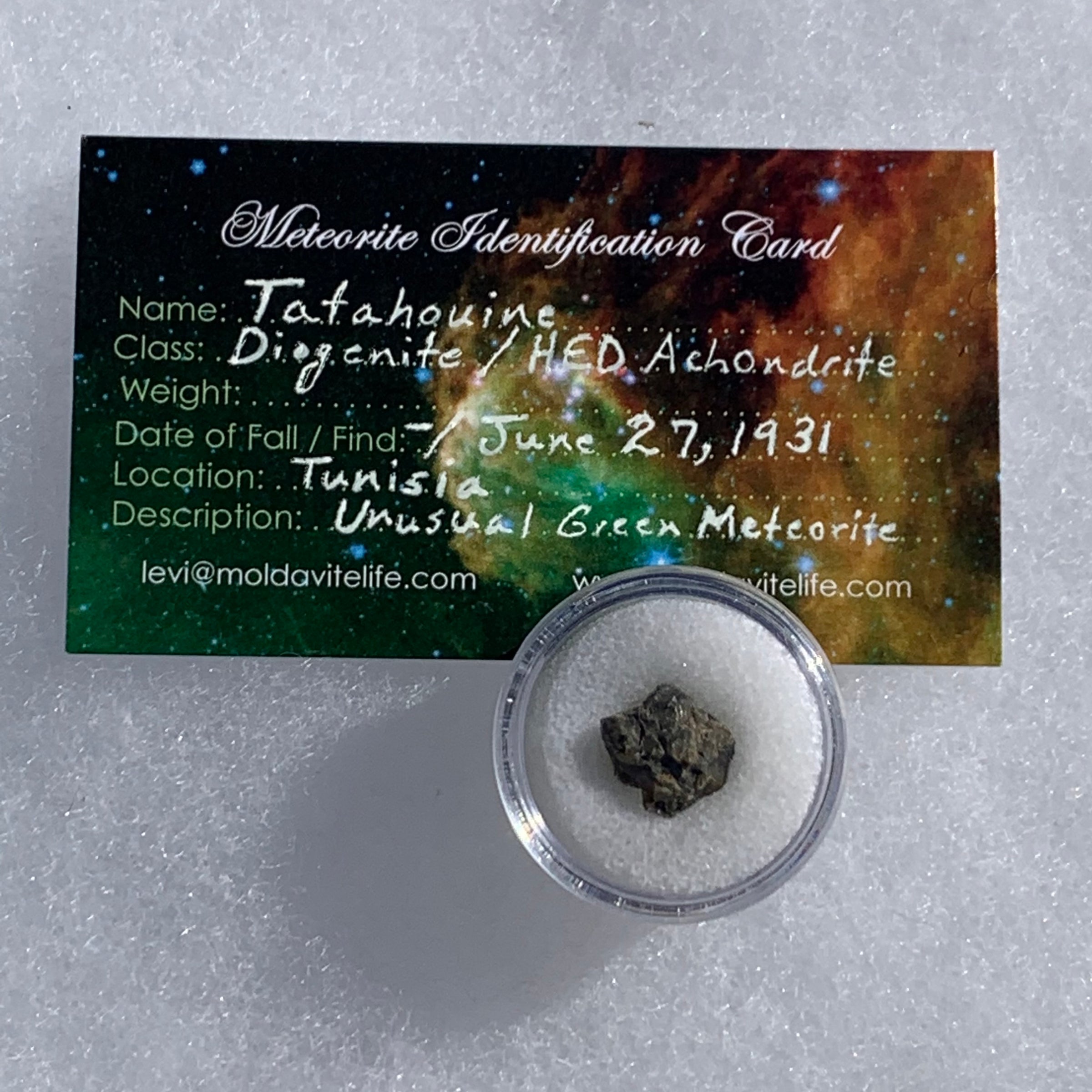 tatahouine meteorite in gem jar with a moldavite life meteorite identification card