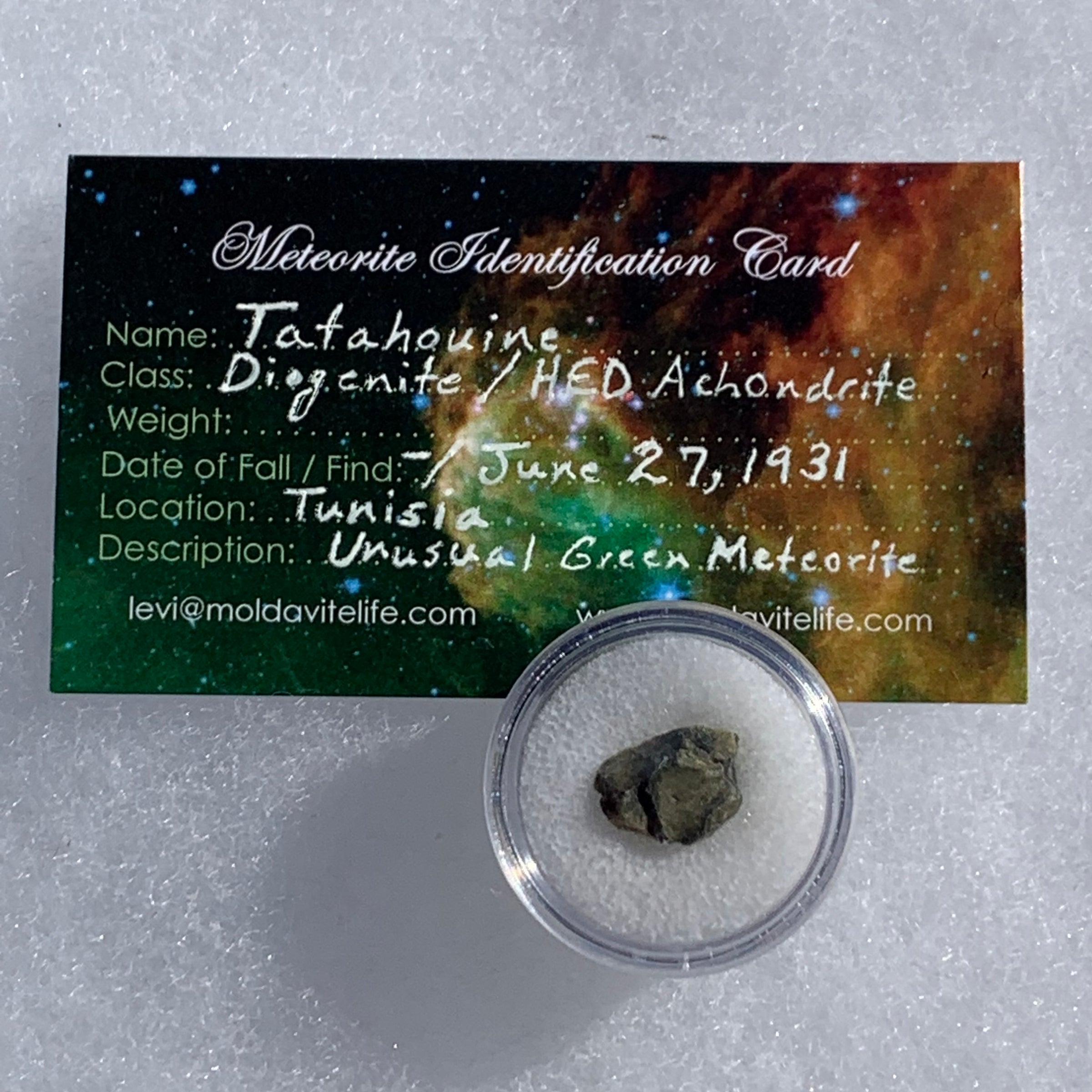 tatahouine meteorite in gem jar with a moldavite life meteorite identification card