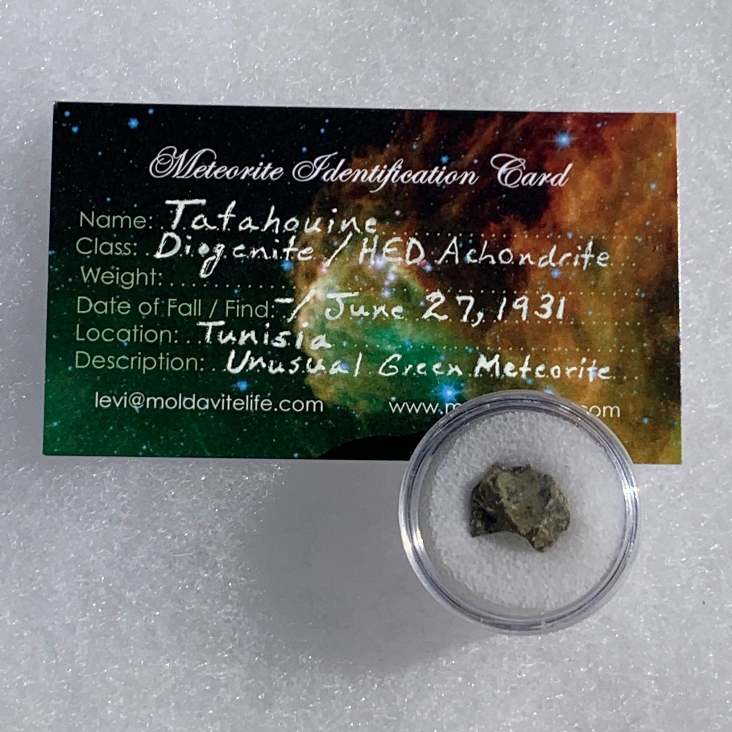 tatahouine meteorite in gem jar with a moldavite life meteorite identification card