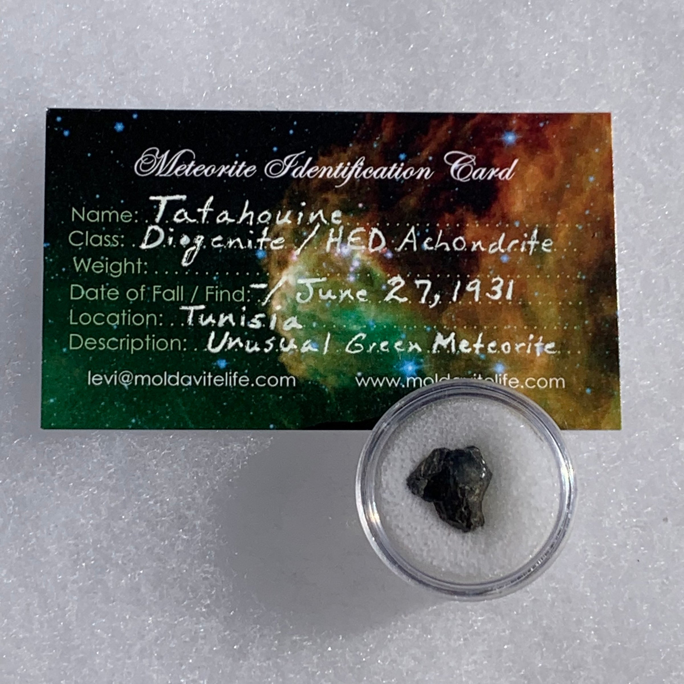 tatahouine meteorite in gem jar with a moldavite life meteorite identification card