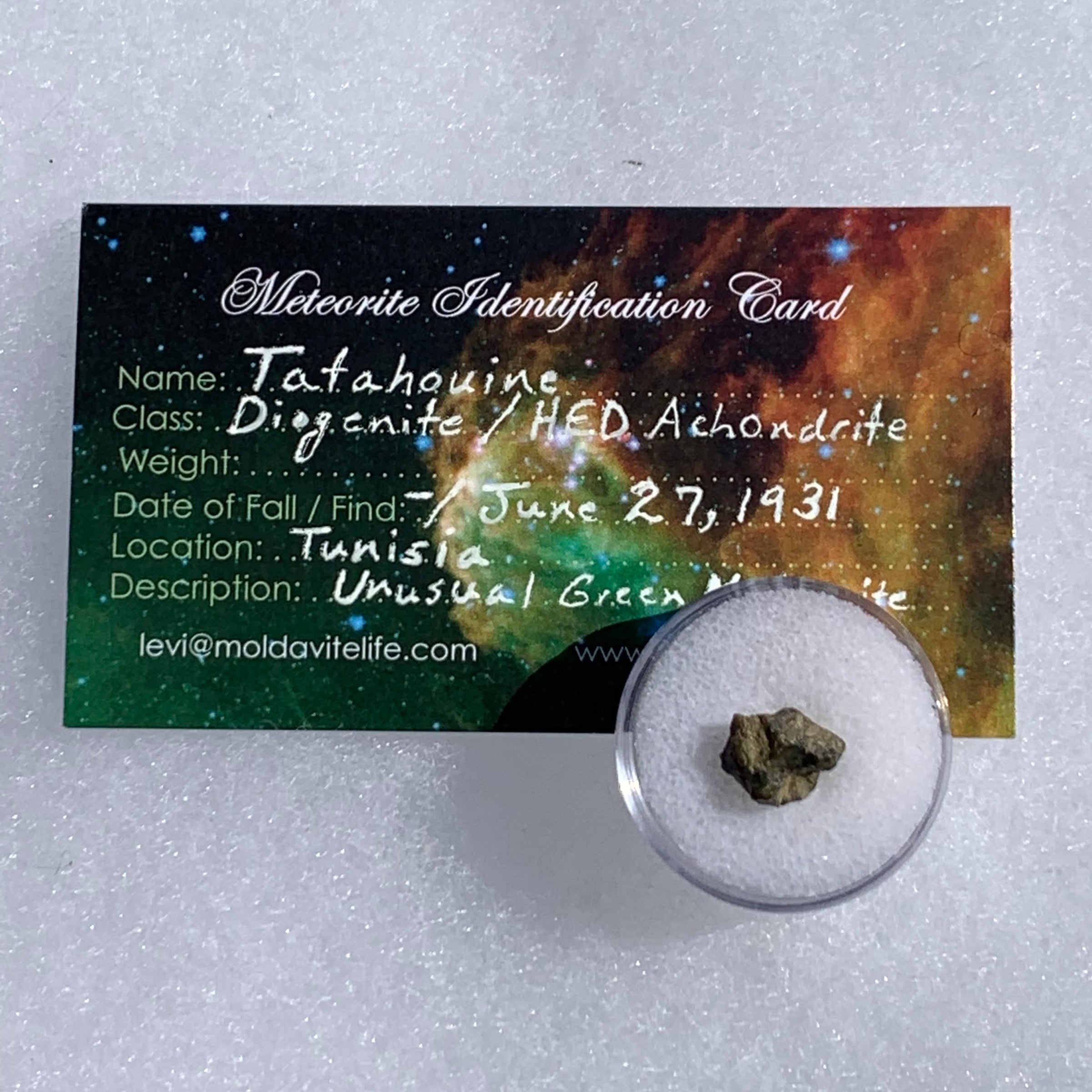 tatahouine meteorite in gem jar with a moldavite life meteorite identification card