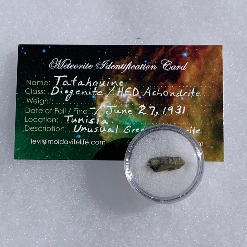 tatahouine meteorite in gem jar with a moldavite life meteorite identification card
